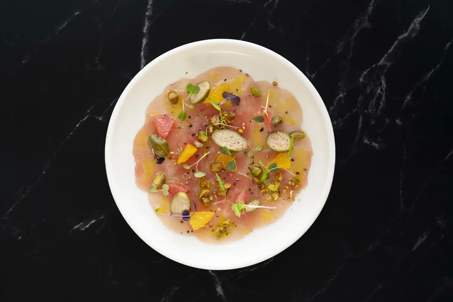 Carpaccio on a black marble table